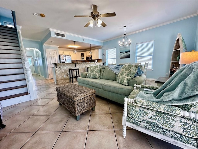 15006 Aruba Dr Unit A, Corpus Christi, TX 78418 - living room featuring light tile patterned floors, stairway, ceiling fan, crown molding, and arched walkways
