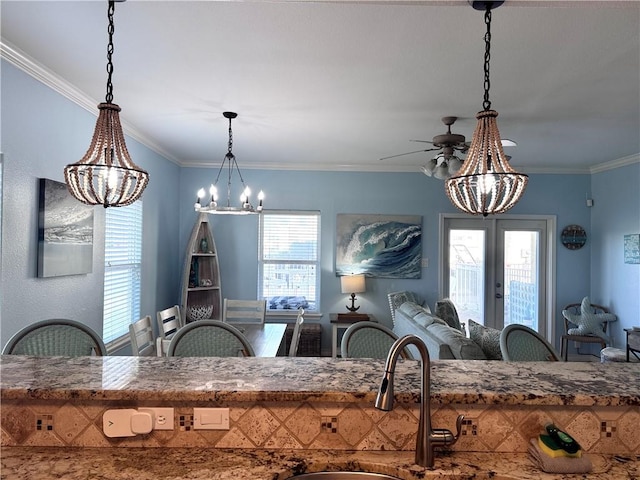 15006 Aruba Dr Unit A, Corpus Christi, TX 78418 - kitchen with a chandelier, french doors, pendant lighting, open floor plan, and ornamental molding