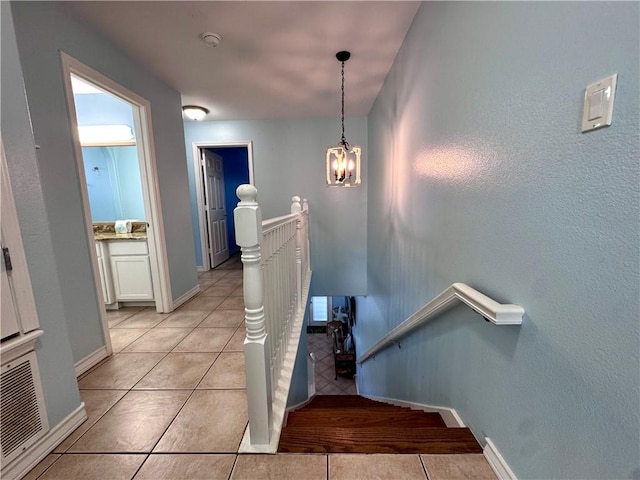 15006 Aruba Dr Unit A, Corpus Christi, TX 78418 - staircase featuring tile patterned floors and a chandelier