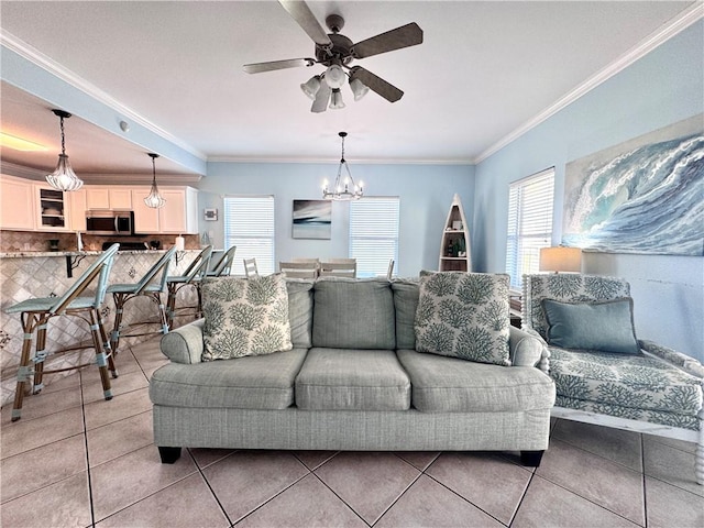 15006 Aruba Dr Unit A, Corpus Christi, TX 78418 - living room with crown molding, light tile patterned floors, a ceiling fan, and a chandelier