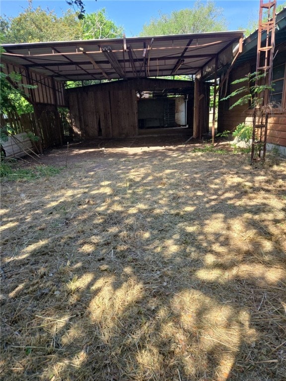 306 S Hall St, Beeville, TX 78102 - view of outdoor structure featuring a carport