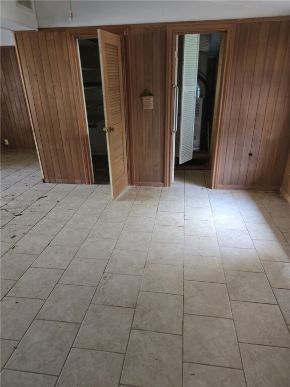 306 S Hall St, Beeville, TX 78102 - spare room with wooden walls