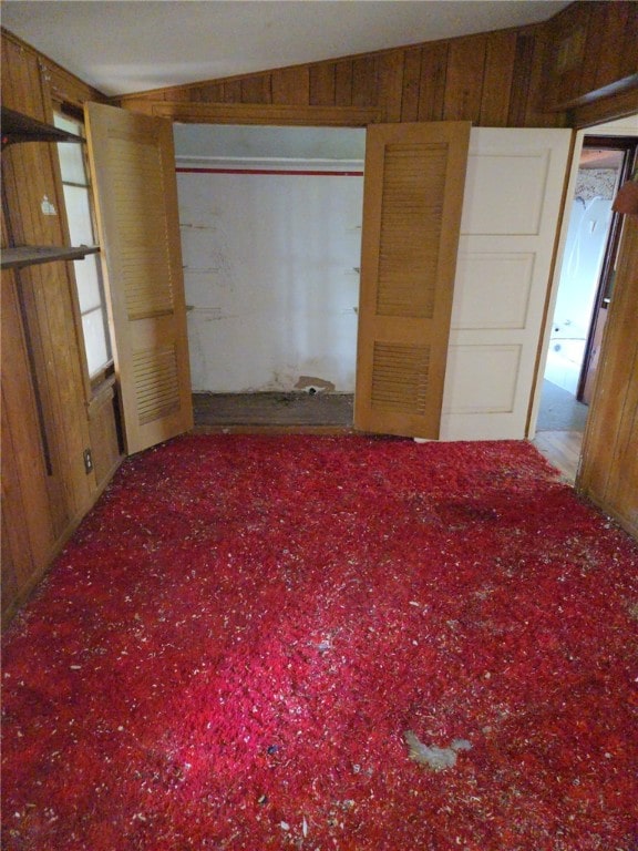 306 S Hall St, Beeville, TX 78102 - unfurnished bedroom featuring wooden walls and carpet flooring
