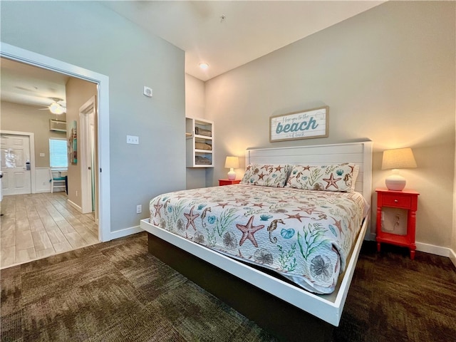 bedroom with dark wood-type flooring