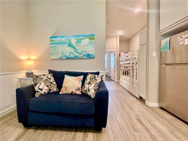 living room with light hardwood / wood-style flooring