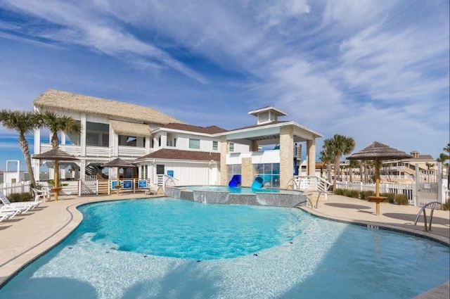 view of pool featuring a patio area, a jacuzzi, and pool water feature