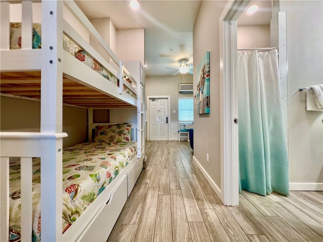 bedroom with ceiling fan and light hardwood / wood-style flooring