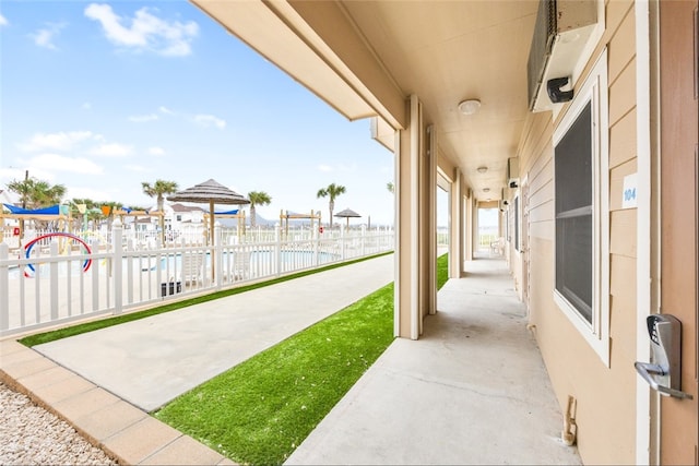 view of patio with a water view and a gazebo