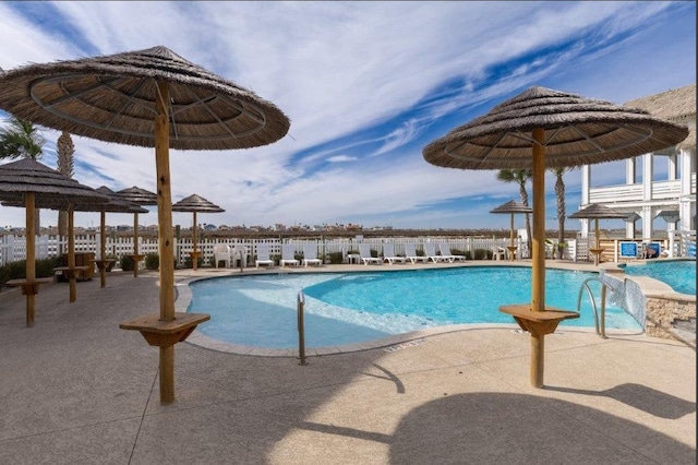 view of swimming pool with a patio