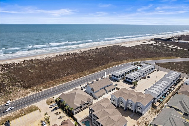 birds eye view of property featuring a view of the beach and a water view