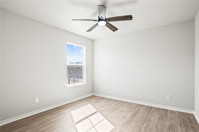 unfurnished room featuring baseboards, light wood-style flooring, and a ceiling fan