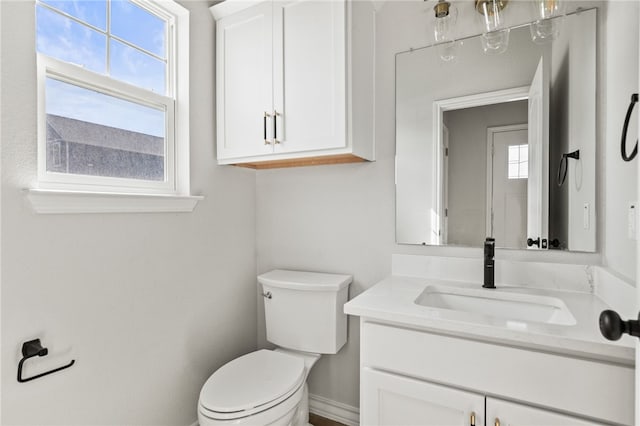 bathroom with toilet and vanity