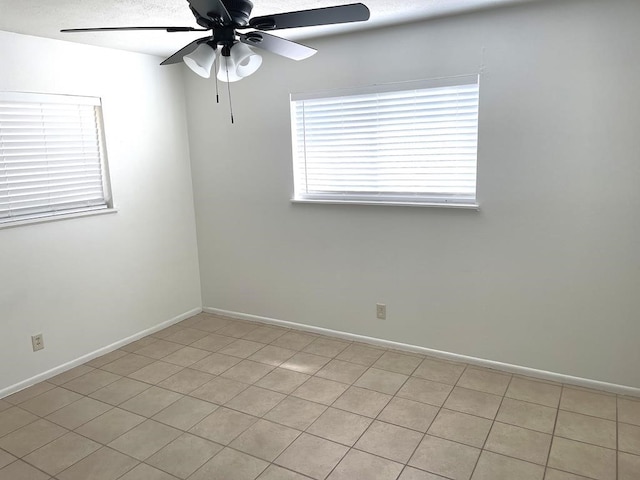 1403 Kingfisher Dr, Beeville, TX 78102 - empty room with a ceiling fan and baseboards