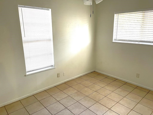 1403 Kingfisher Dr, Beeville, TX 78102 - spare room featuring light tile patterned floors and baseboards