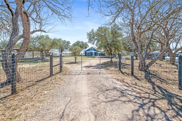 view of road featuring a gated entry and a gate