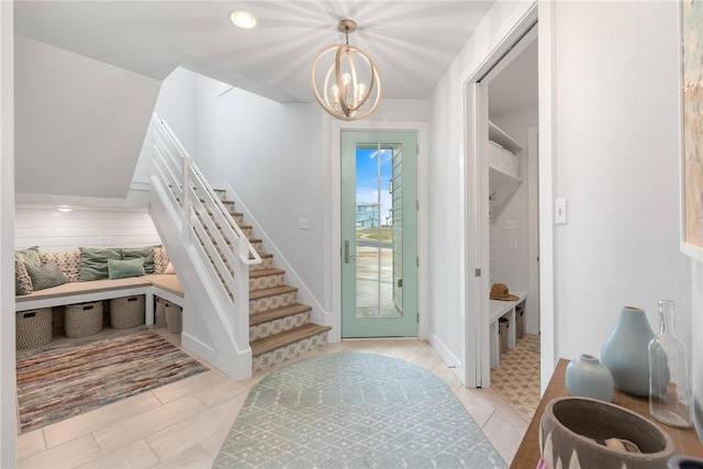 entryway with an inviting chandelier