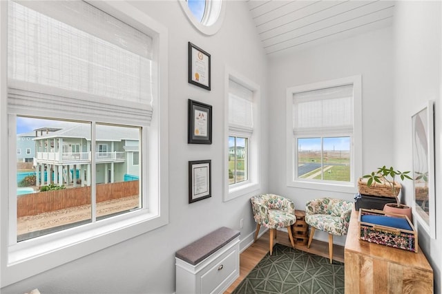 living area featuring dark wood finished floors and baseboards