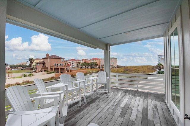 wooden terrace featuring a residential view