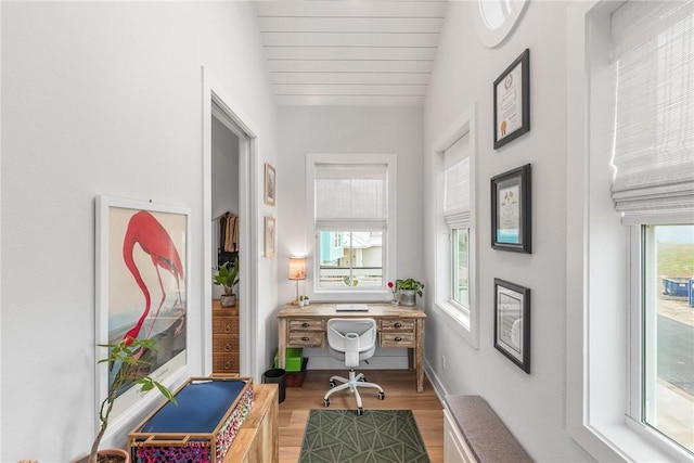 bedroom with visible vents, ceiling fan, wood finished floors, high vaulted ceiling, and beamed ceiling