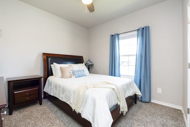 bedroom with ceiling fan, baseboards, and carpet