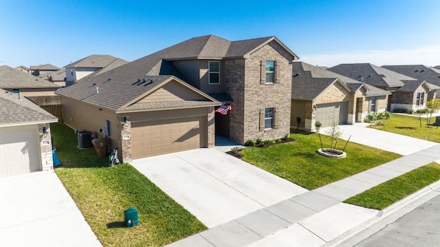 view of front of home with central air condition unit, a front lawn, a residential view, concrete driveway, and brick siding