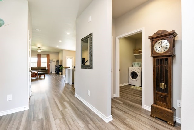 hall with recessed lighting, washer / dryer, light wood-type flooring, and baseboards