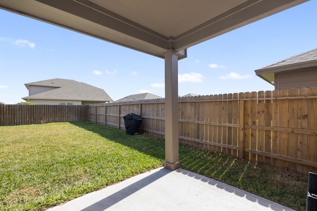 view of yard with a patio and a fenced backyard