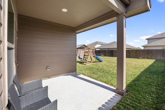 view of patio / terrace with a fenced backyard and a playground