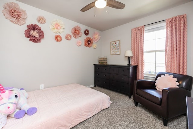 bedroom featuring light colored carpet and ceiling fan