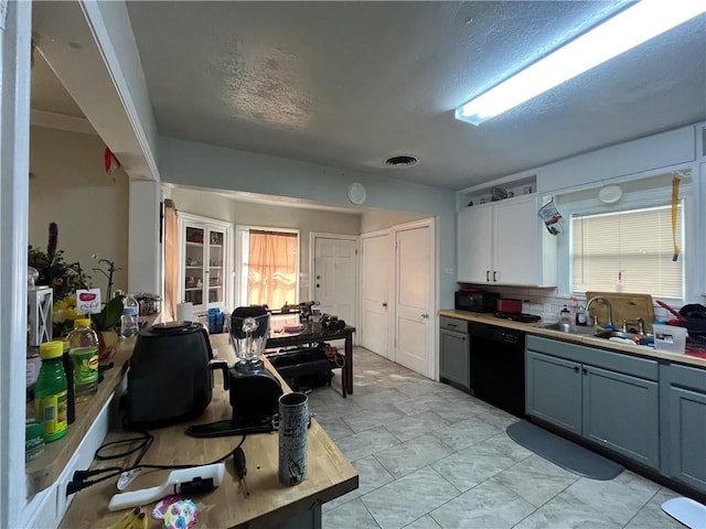 1253 Logan Ave, Corpus Christi, TX 78404 - kitchen featuring black appliances, a sink, a textured ceiling, light countertops, and gray cabinets