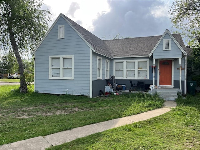 1253 Logan Ave, Corpus Christi, TX 78404 - bungalow featuring roof with shingles and a front yard
