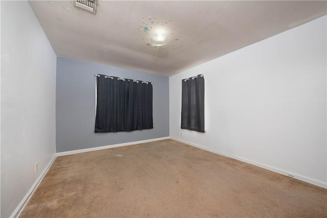 unfurnished room with carpet floors