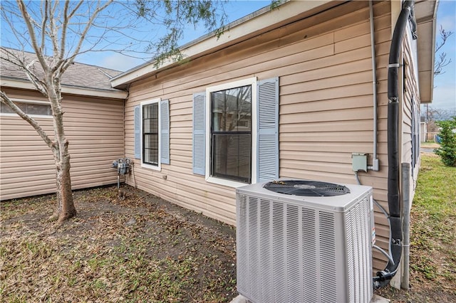 view of property exterior with cooling unit