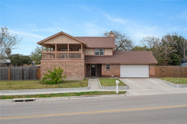 front of property with a garage and a balcony