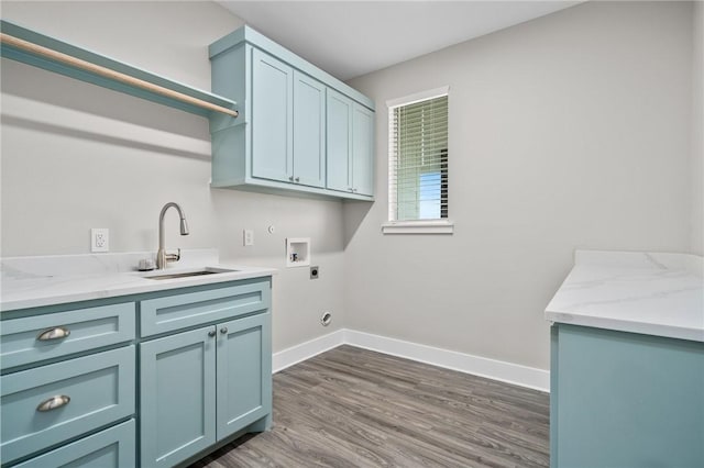 washroom with cabinets, hookup for a washing machine, electric dryer hookup, sink, and dark hardwood / wood-style floors