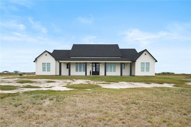 ranch-style house featuring a front lawn