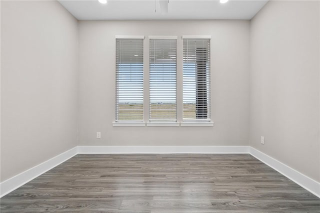 empty room with dark wood-type flooring