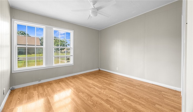 unfurnished room featuring light hardwood / wood-style floors and ceiling fan