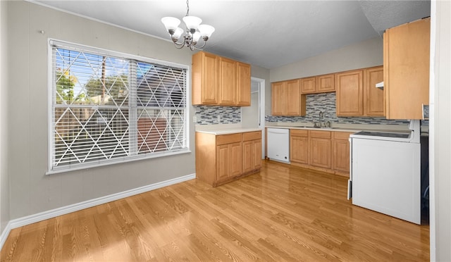 kitchen with tasteful backsplash, washer / clothes dryer, sink, light hardwood / wood-style floors, and dishwasher