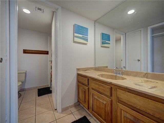 5973 State Highway 361 Unit 433, Port Aransas, TX 78373 - bathroom with vanity, toilet, tile patterned flooring, baseboards, and recessed lighting