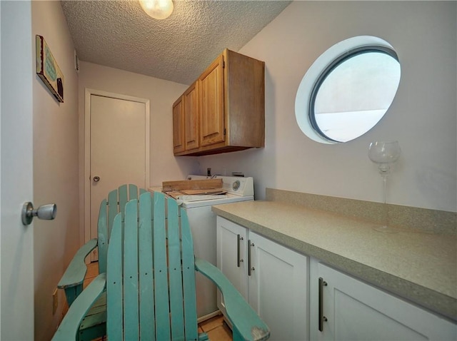 5973 State Highway 361 Unit 433, Port Aransas, TX 78373 - laundry area with a textured ceiling and cabinet space