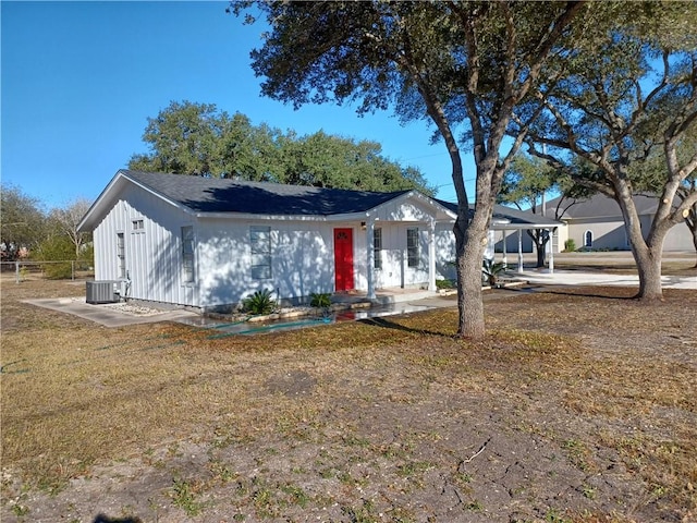 ranch-style home featuring central AC unit