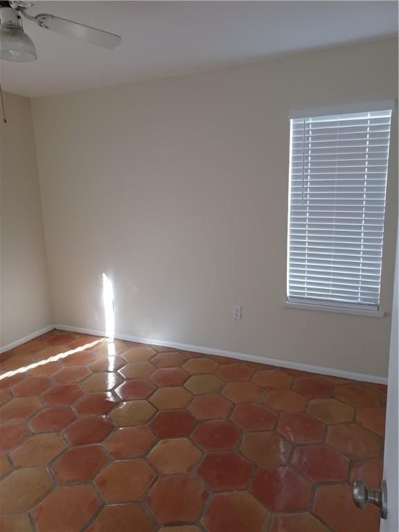 spare room with ceiling fan