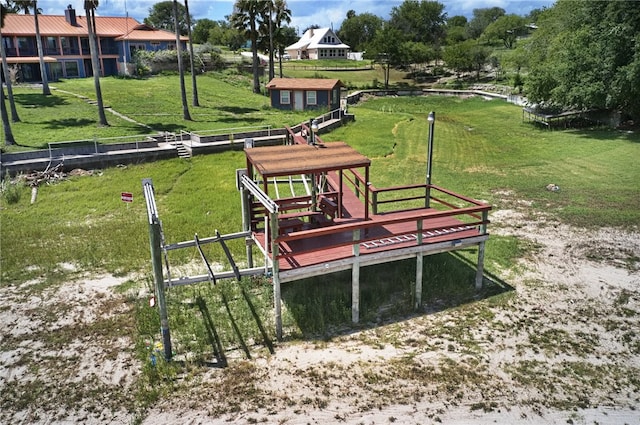 view of property's community with a lawn