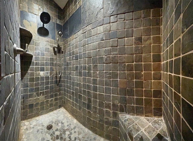 bathroom with tiled shower