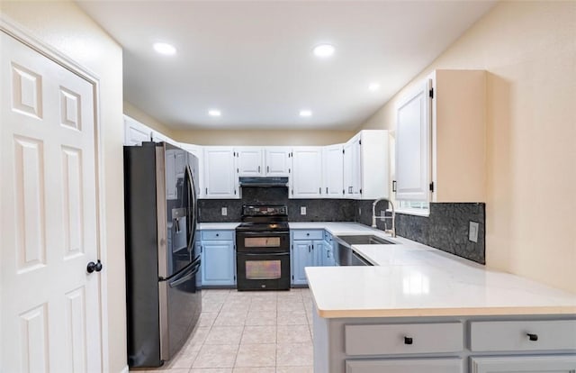 329 Yorktown Blvd, Corpus Christi, TX 78418 - kitchen featuring double oven range, fridge with ice dispenser, under cabinet range hood, a sink, and decorative backsplash