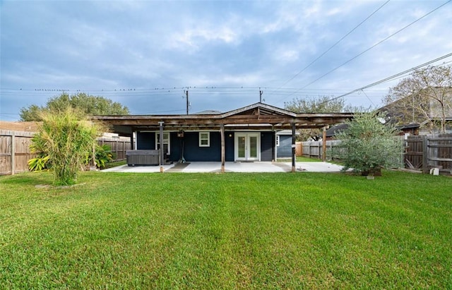 329 Yorktown Blvd, Corpus Christi, TX 78418 - rear view of property featuring french doors, a patio area, and a hot tub