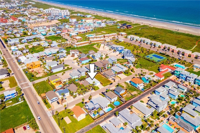 drone / aerial view featuring a view of the beach and a water view