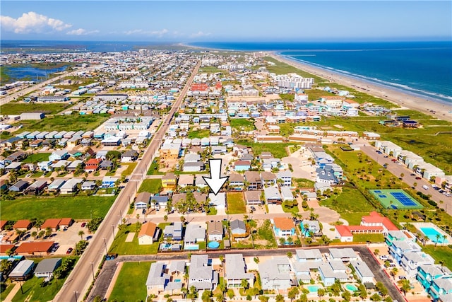 drone / aerial view featuring a view of the beach and a water view