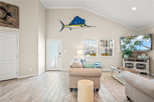 living room with light hardwood / wood-style floors, high vaulted ceiling, and crown molding